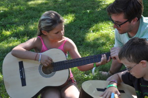 girl learning guitar